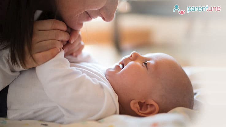 women playing with baby